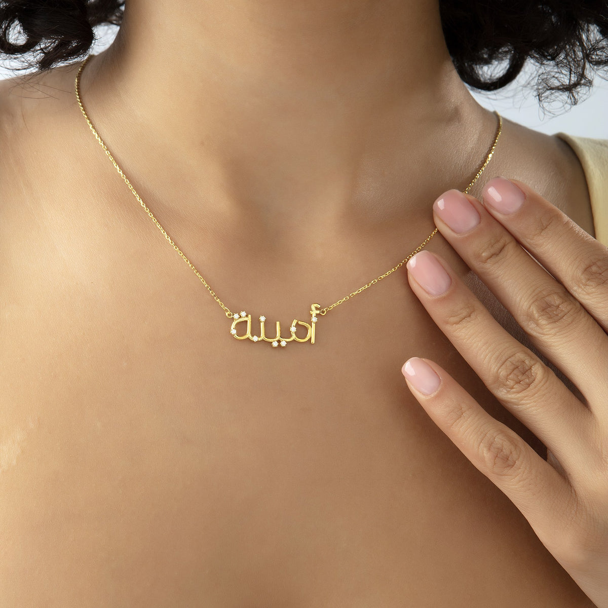 Custom Arabic letter name necklace worn at the collarbone