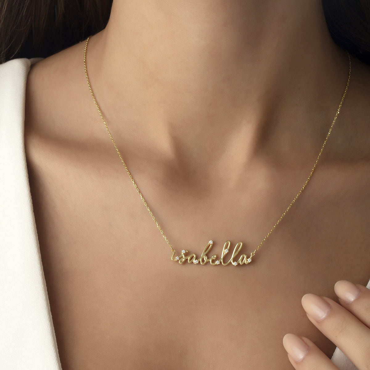 Dainty name necklace worn every day at the collarbone in 14K gold vermeil
