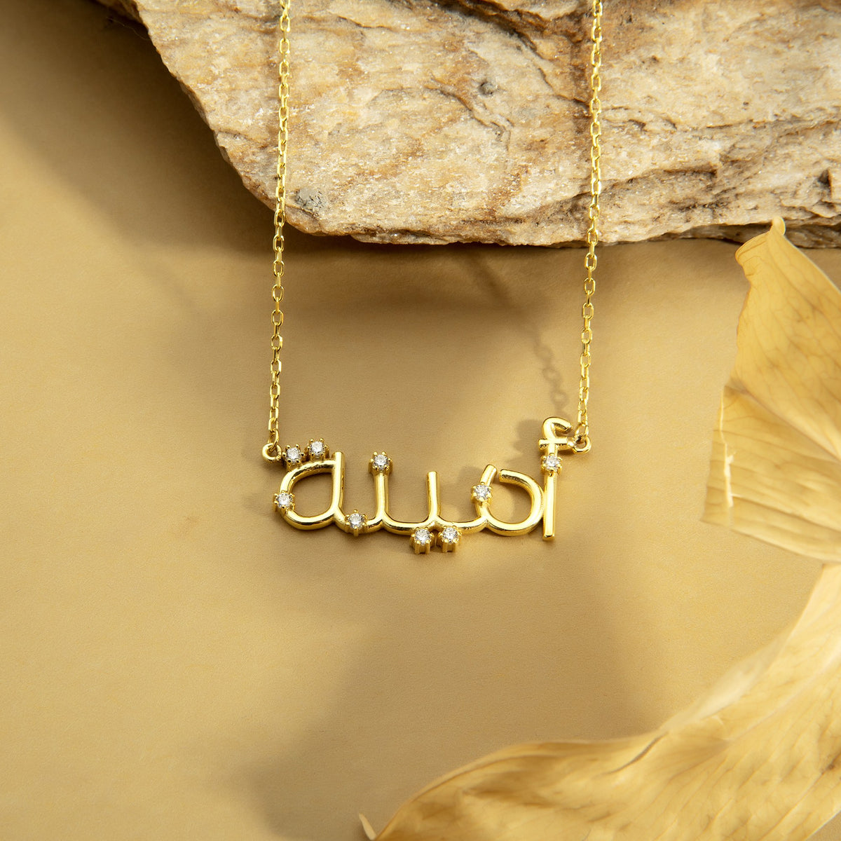 Arabic name necklace in 14K gold vermeil with diamond-look CZ stones, close-up