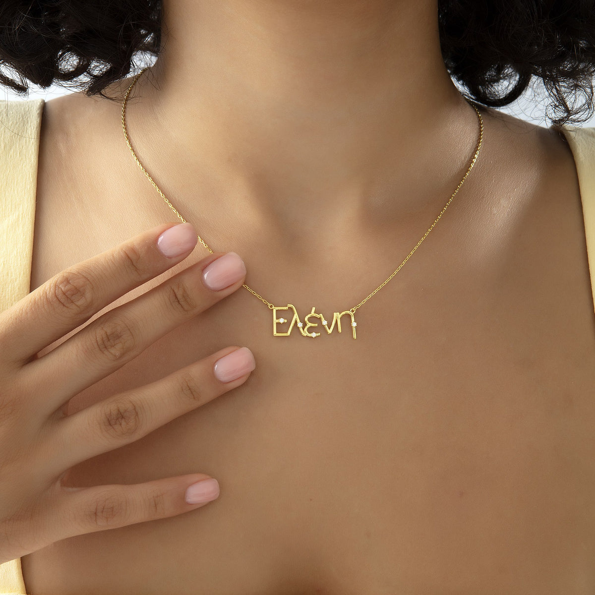 Custom Greek letter name necklace worn at the collarbone